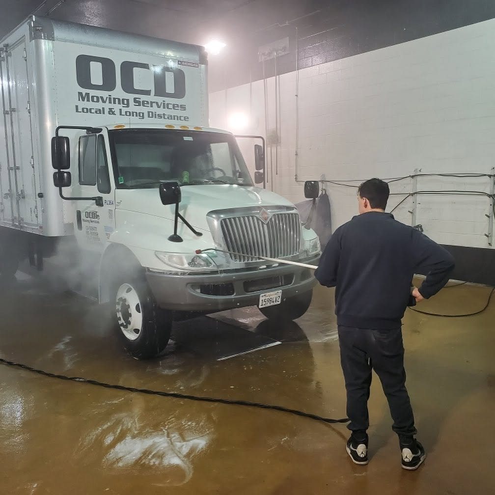 OCD Moving Services team keeping a truck spotless between jobs
